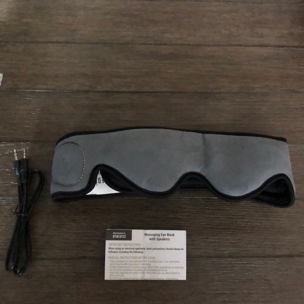 Massaging eye mask with speakers